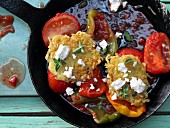 Potato and feta pancakes with stewed peppers and oregano
