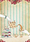Woman pouring tea above cupcakes