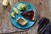 Beetroot quiche, fried fish fillet and cucumber salad