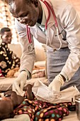 Doctor caring for a baby in hospital