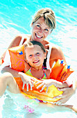 Mother and daughter at swimming pool