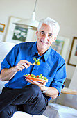 Senior man eating a salad