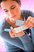 Woman holding medications