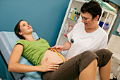 Pregnant woman and midwife