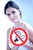Woman with a No smoking sign