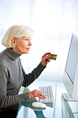 Senior woman making online purchase