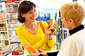 Pharmacist showing products
