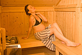 Pregnant woman in a sauna