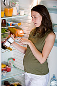 Pregnant woman checking food