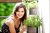 Woman smelling mint leaves