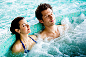 Couple in spa pool