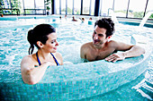 Couple in spa pool