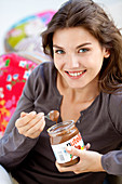 Woman eating Nutella