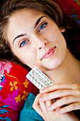 Woman with contraceptive pills