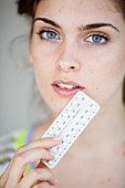 Woman with contraceptive pills