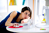 Woman at work looking bored