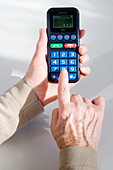 Elderly person using phone