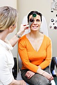 Woman undergoing eyesight test