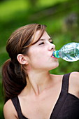 Teenager drinking mineral water