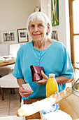 Elderly woman buying groceries