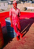Asian worker at a polluting chemical dye factory