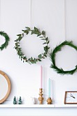 Simple wreaths of eucalyptus and pine branches on wall