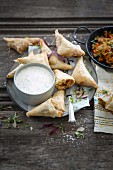 Spicy chicken, atchar and Brie samosas with a sour cream and coriander dip