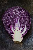 Cut in half red cabbage in artisanal metal bowl