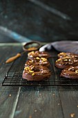 Donuts with a chocolate glaze and chopped nuts
