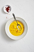 Creamy carrot soup with coconut milk and cayenne pepper
