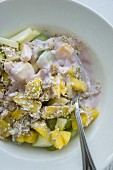 Muesli with oatmeal, mango, grapes and apples
