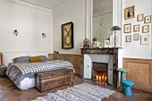 Wainscoting and fireplace in bedroom of period building