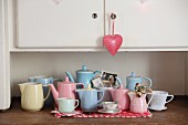 Collection of retro pastel jugs on kitchen dresser