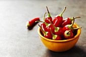 Red Hot Chili Peppers in bowl over vintage background