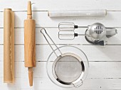 Kitchen utensils for making dough: blender, rolling pin, strainer, baking paper, cling film