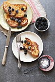 French toast with honey, fresh blackberries and dusted with icing sugar
