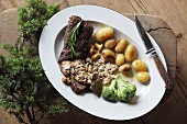 Venison with mushroom sauce and baby potatoes