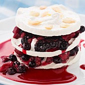 Sweet delicious dessert - meringue with berry layers
