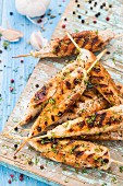 Delicious chicken skewers with herbs and pepper