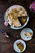 Pistachio and Rose Cake, Sliced to Serve with Jug of Icing