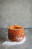 Cronut on a grey background.Croissant and doughnut mixture