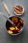 Infused wine with citrus, cinnamon, anise and brown sugar