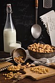 Dried peanuts and milk on table