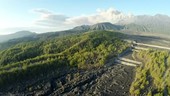 Volcano erupting in distance, Sakurajima