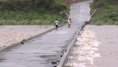 Flooded river and low bridge, Philippines