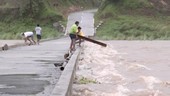 Flooded river and low bridge, Philippines