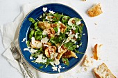 Rocket and herb salad with artichoke hearts and mustard dressing