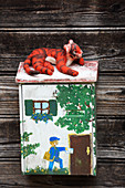 Hand-made, felted, woollen tiger on letterbox