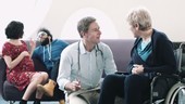 Doctor consulting patient in hospital waiting room