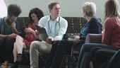 Doctor consulting patient in hospital waiting room